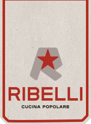 Close up of a pizza on a plate next to a menu of RIBELLI restaurant